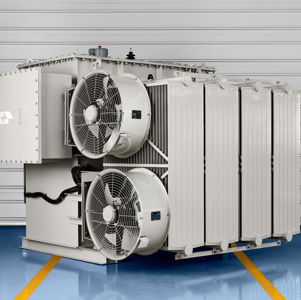 Substation power transformer with radiator bank and fan cooling